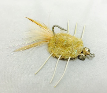 Crab Rag Head Tan L.E. fly with broad rag head body, tan coloration, and rubber legs.
