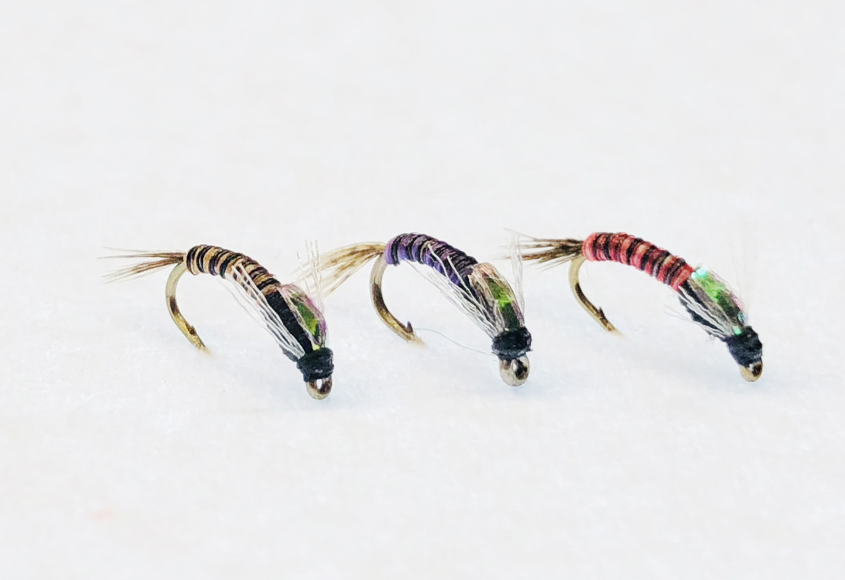 Juju Baetis fly with slim segmented body and realistic wing case imitating Baetis nymphs.