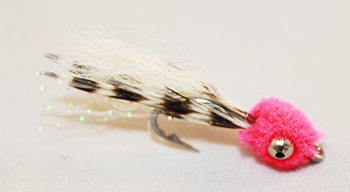 orange Mini Puff saltwater fly with bead chain eyes and craft fur tail for bonefish and redfish fishing