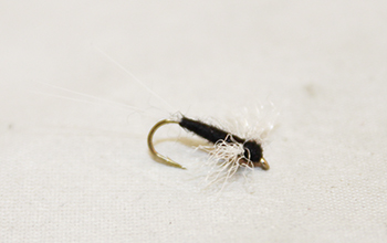 Trico Spinner Male dry fly with slim black body and spent wings imitating tiny mayflies. Fishing flies.