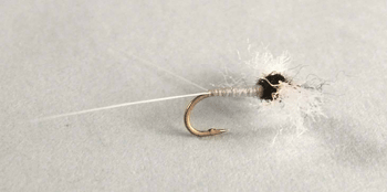 Trico Spinner fly with slim dark body & spent wings imitating summer Trico mayflies. Fishing flies.