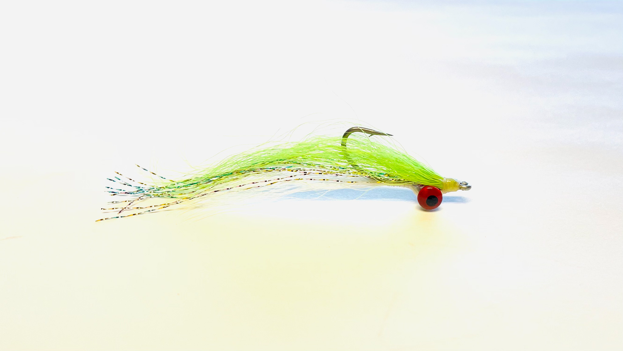 Clouser Minnow in Chartreuse/White is a versatile streamer fly designed to imitate baitfish.