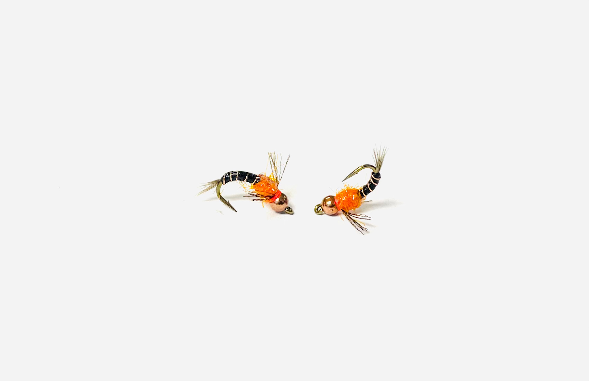 Flashy Pheasant Tail Hot Pants fly with hot spot trigger for trout fishing.