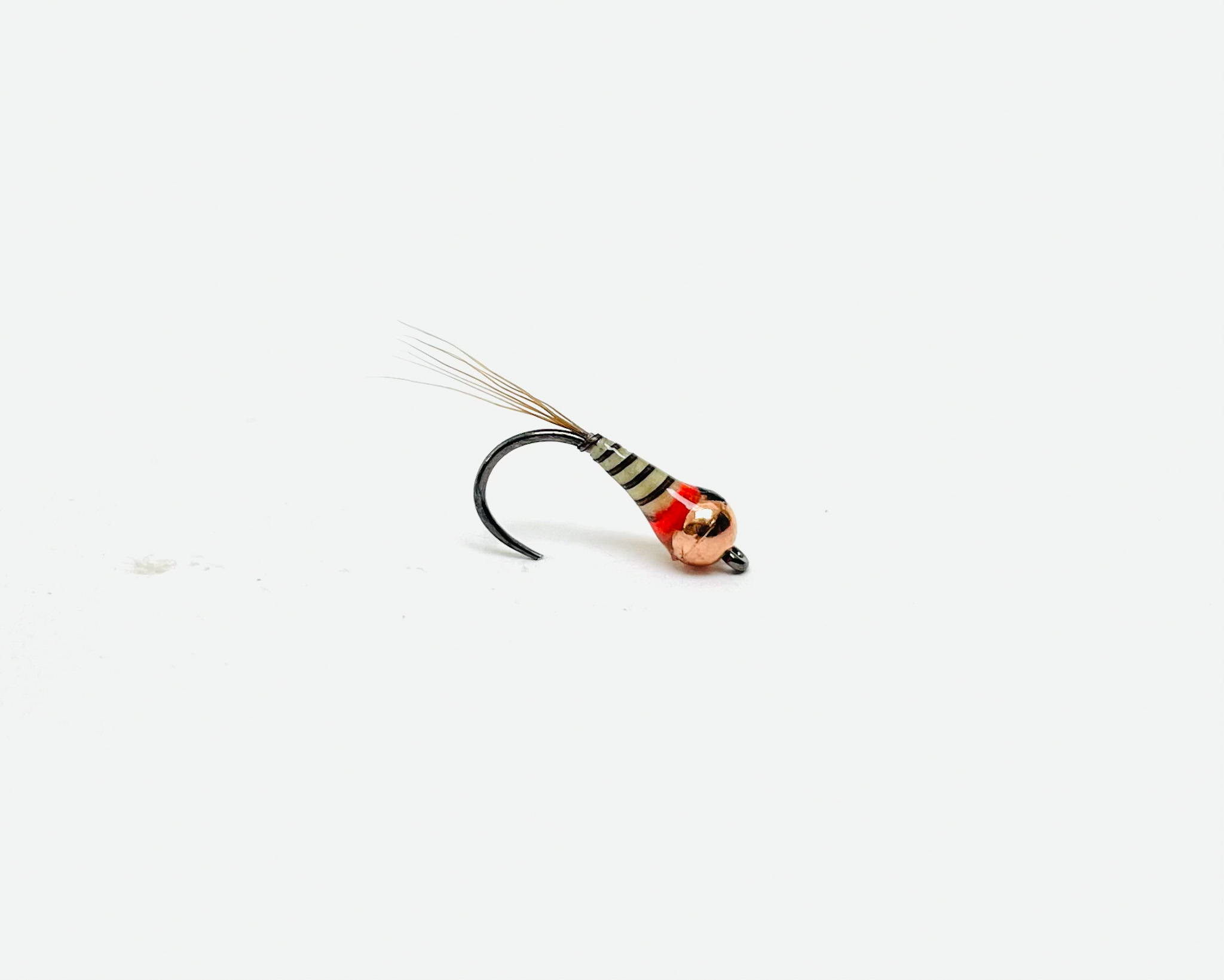 B's Perdigon Baetis Lite is a streamlined euro-style nymph tied on a barbless Hanak jig hook.