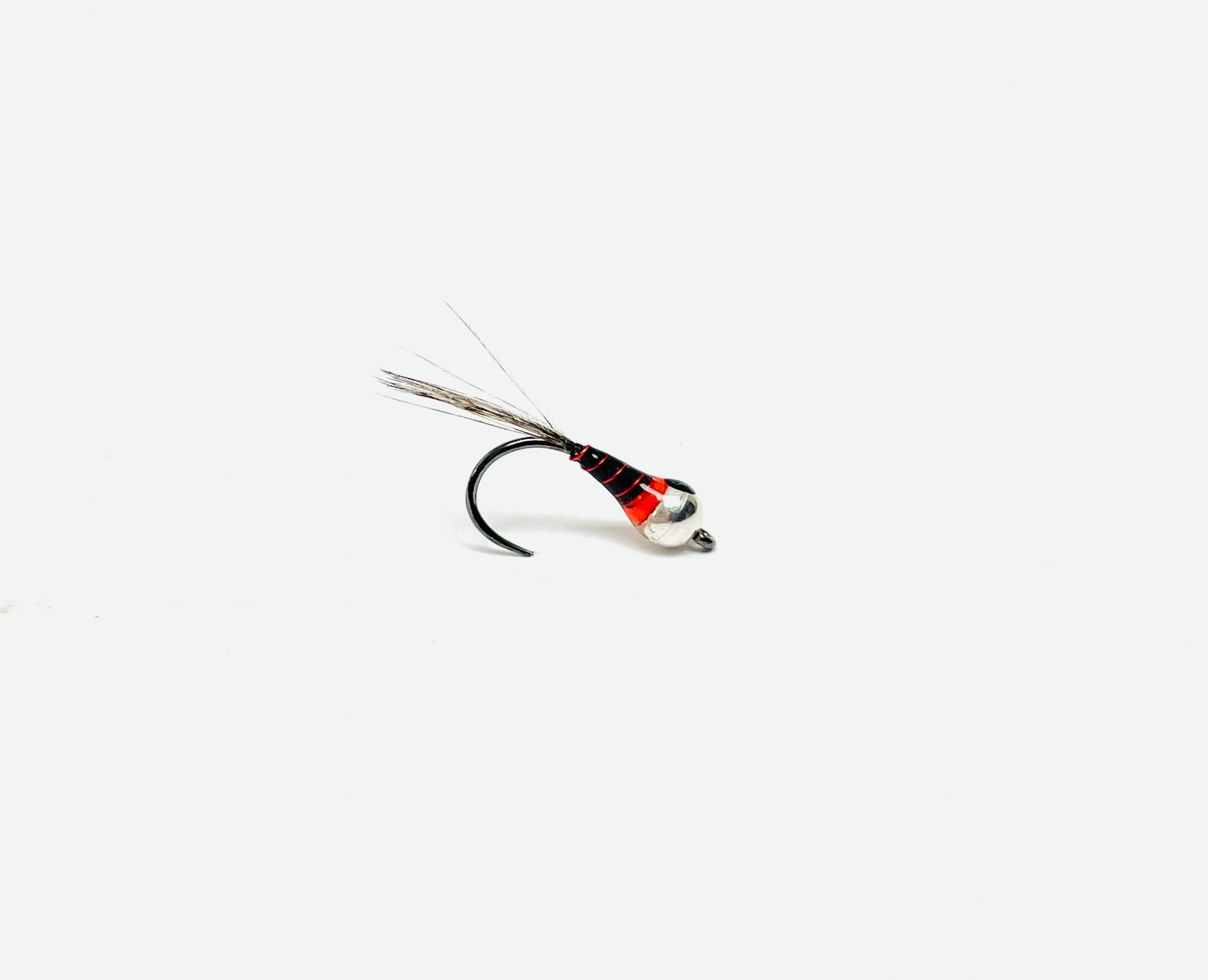 B's Perdigon Black/Red is a sleek, euro-style nymph tied on a strong, barbless Hanak hook.
