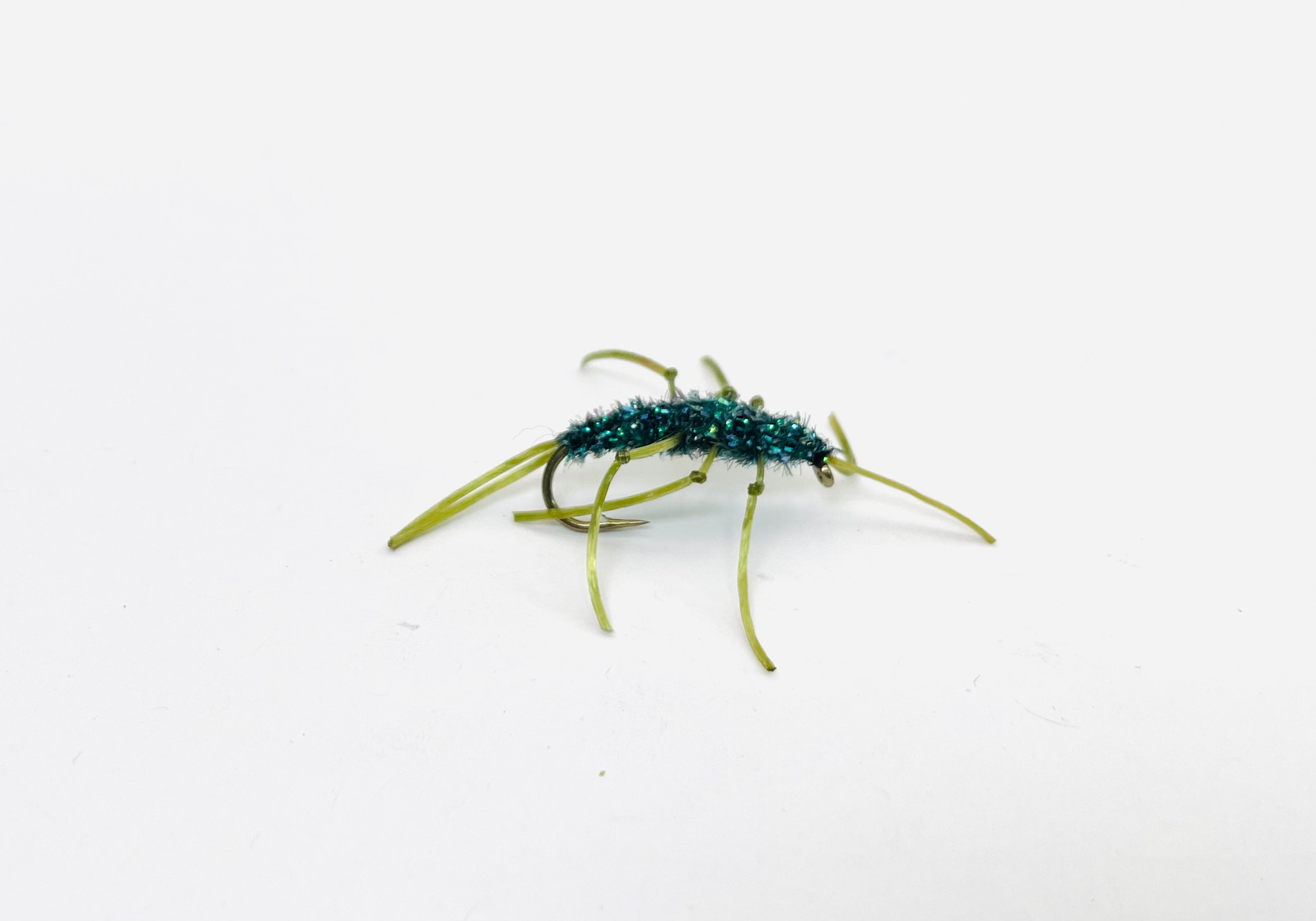 Pat’s Stone Peacock Dub fly with peacock body dubbing and rubber legs. Fishing flies