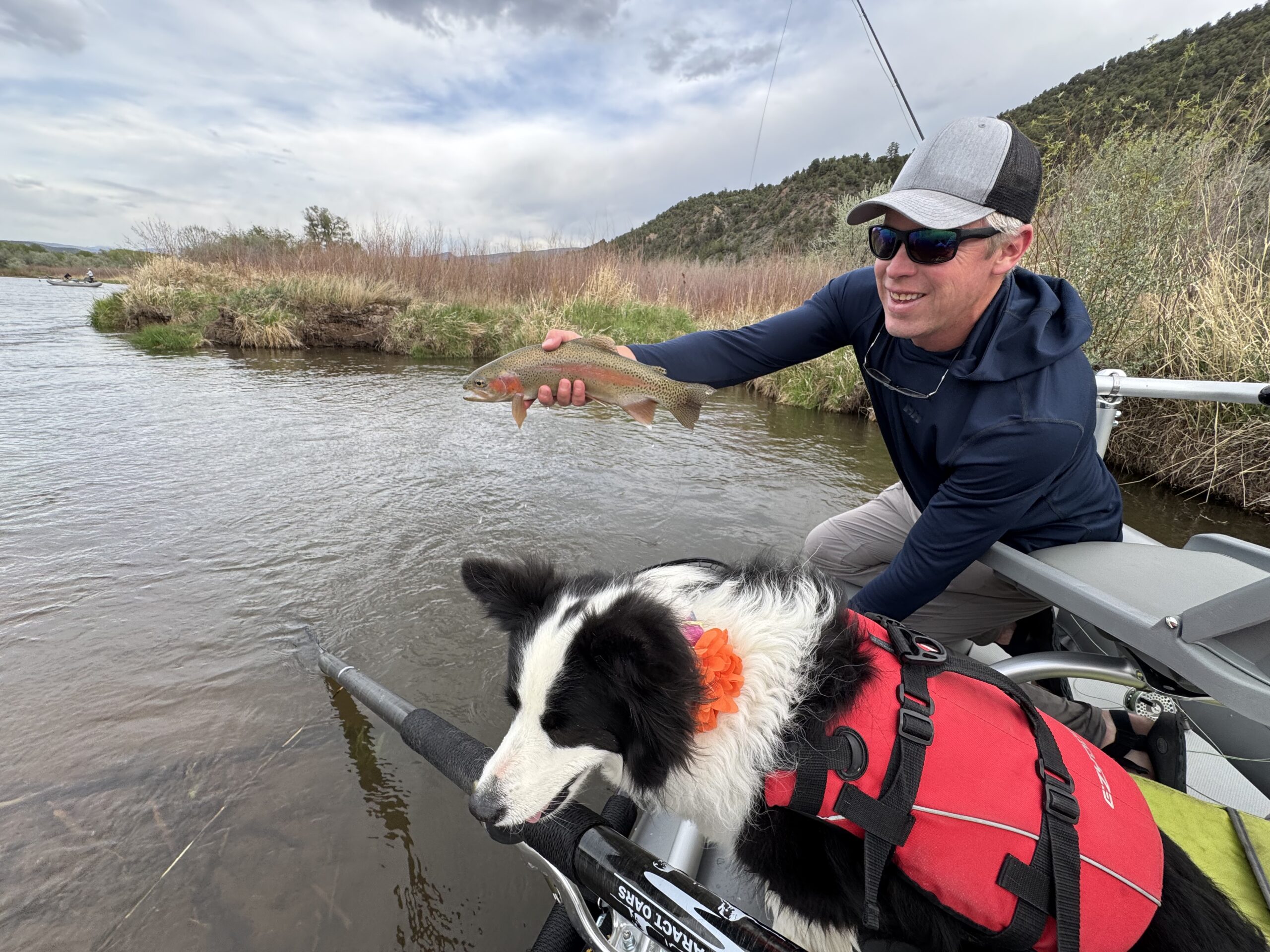 float with man dog fish using Hiill's Discount fly fishing flies
