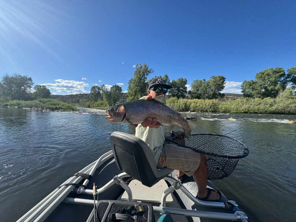 float roaring fork man with big trout