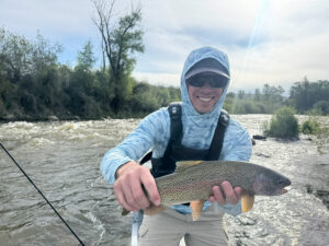 Eagle river runooff  Man holding nice tout